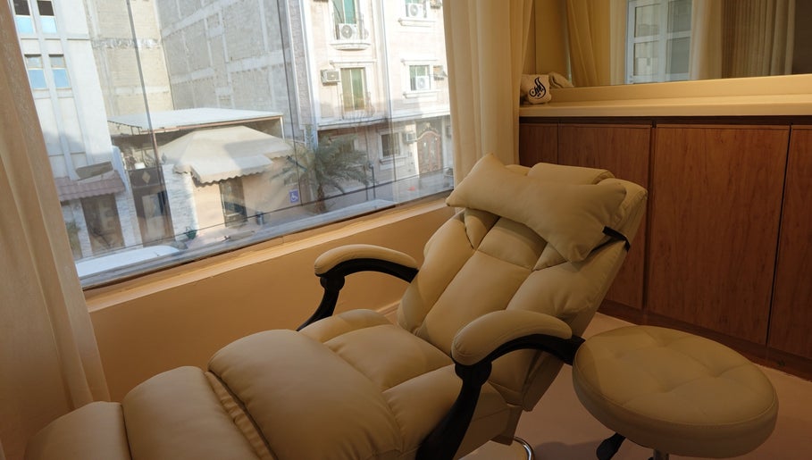 Relaxing spa chair in Eileen Spa, Al Khobar, Eastern Province, SA with city view in background.