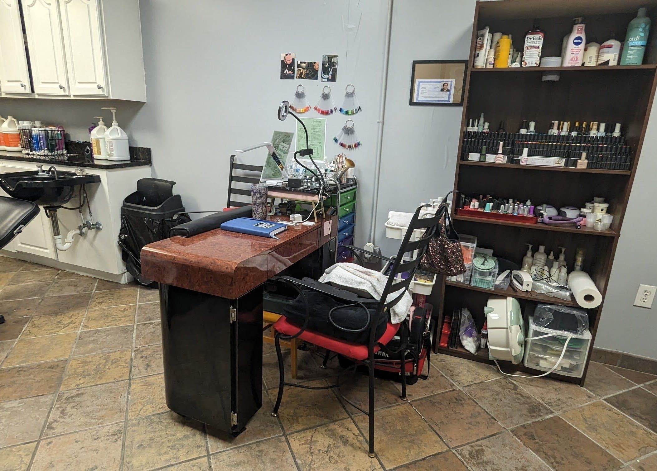 Nail art station at Sparkles Gel & Nail Art Studio, Camden, South Carolina, US, showcasing tools and products.