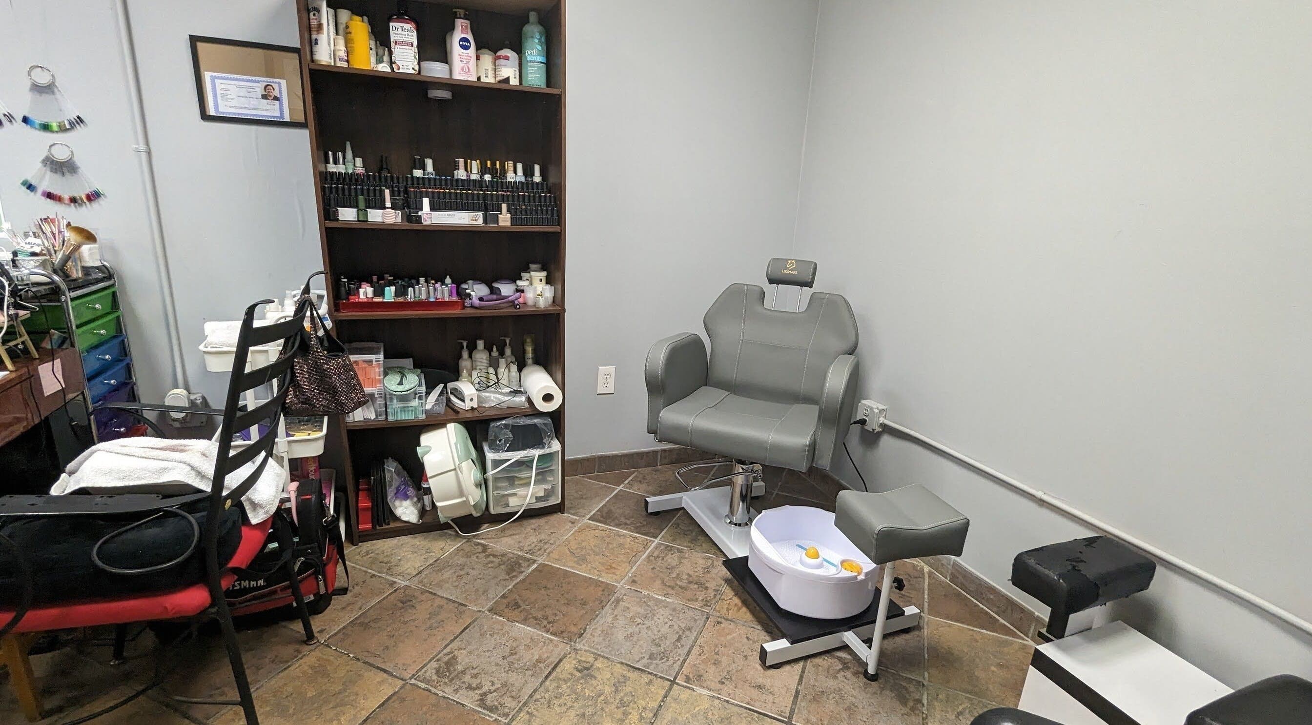 Comfortable pedicure chair and colorful nail supplies at Sparkles Gel & Nail Art Studio, Camden, South Carolina, US.