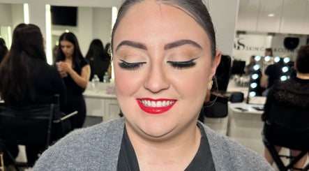 Client with stunning makeup at Naomi Lee Makeup, Catherine Field, New South Wales, AU, smiling brightly.