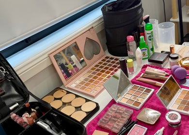 Makeup setup at Naomi Lee Makeup in Catherine Field, New South Wales, AU featuring palettes and brushes.