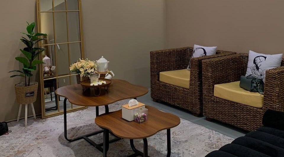 Relaxing lounge area at Lunar And Sky Spa Studio, Shah Alam, Selangor, MY, with stylish wicker chairs and decor.