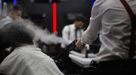 Gentleman receives a steam treatment at Barbarco, Dubai, Dubai, AE, enhancing hair care experience.