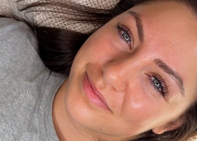 Client with glowing skin at Beauty by Ella Grace, Little Eaton, England, GB, showing natural beauty post-treatment.