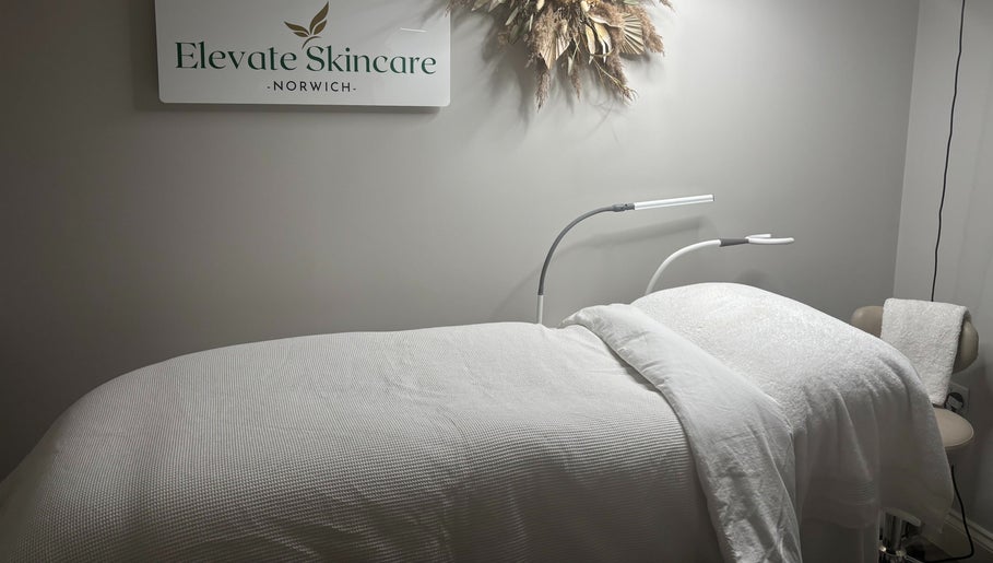 Cozy treatment room at Elevate Skincare Norwich, featuring a luxurious bed and elegant decor in Norwich, England, GB.