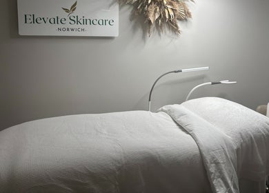 Cozy treatment room at Elevate Skincare Norwich, featuring a luxurious bed and elegant decor in Norwich, England, GB.