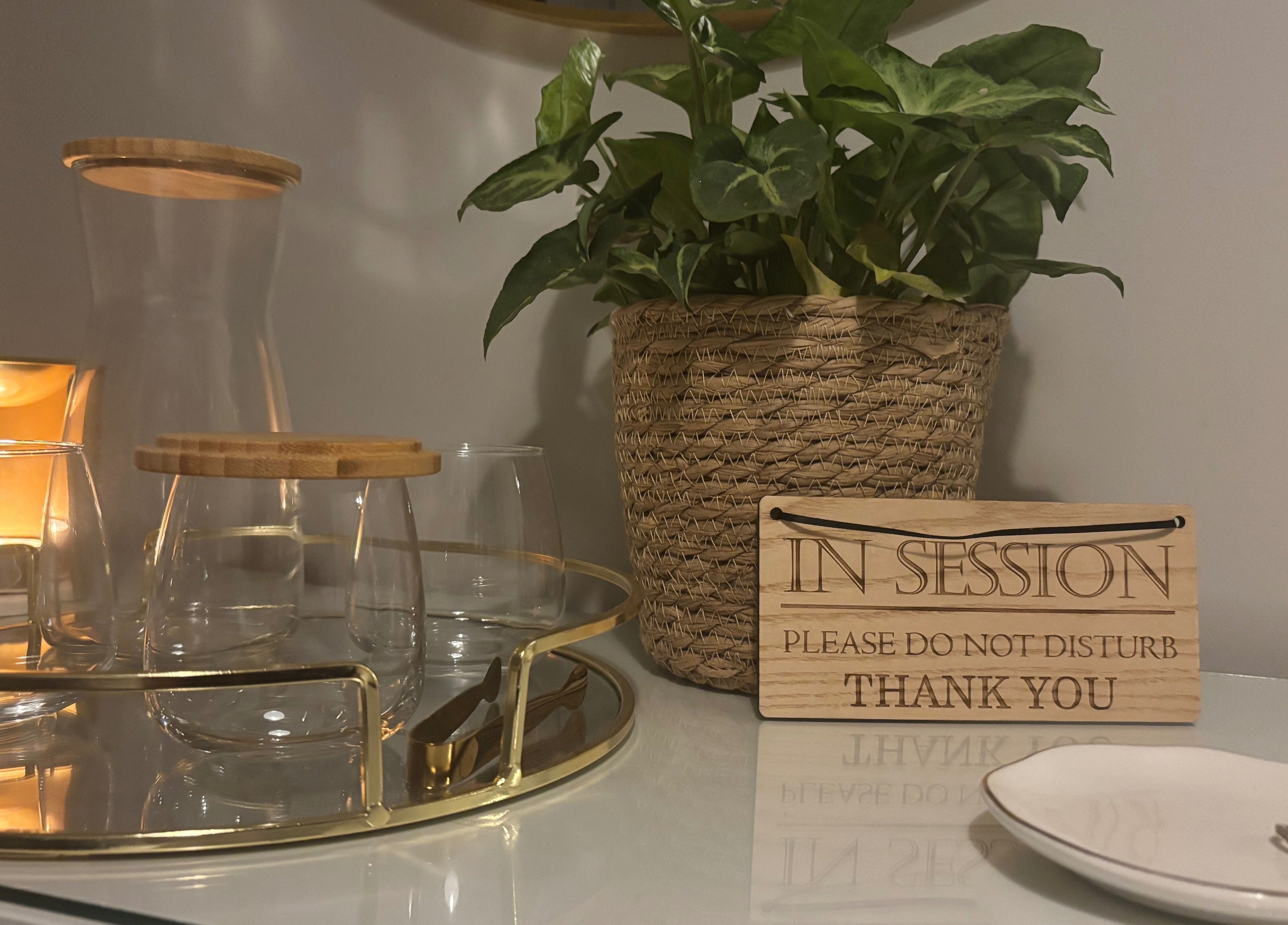 Calming setup at Elevate Skincare Norwich, Norwich, England, GB with plants, glassware, and a session sign.