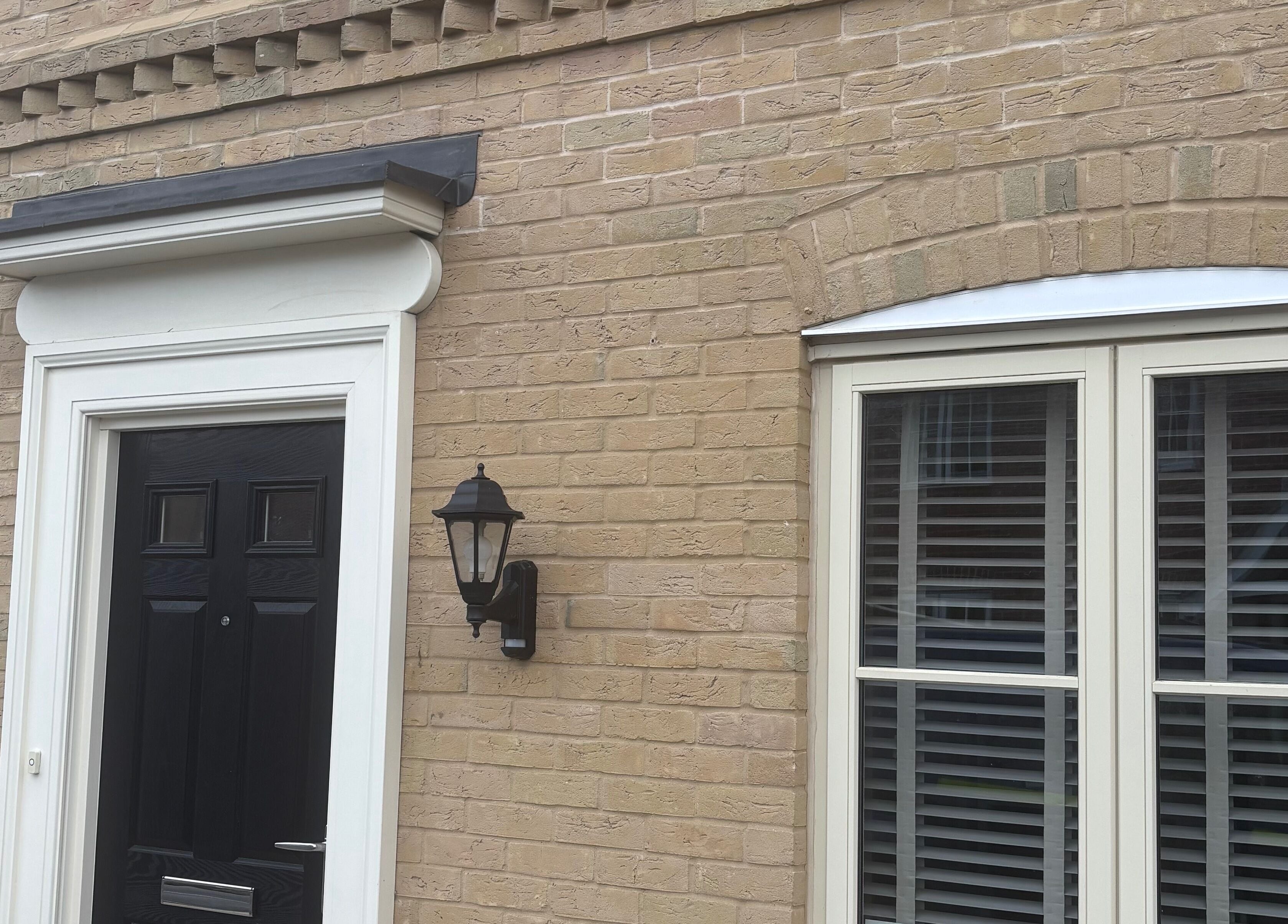 Elegant black door and window at Elevate Skincare Norwich, Norwich, England, GB.