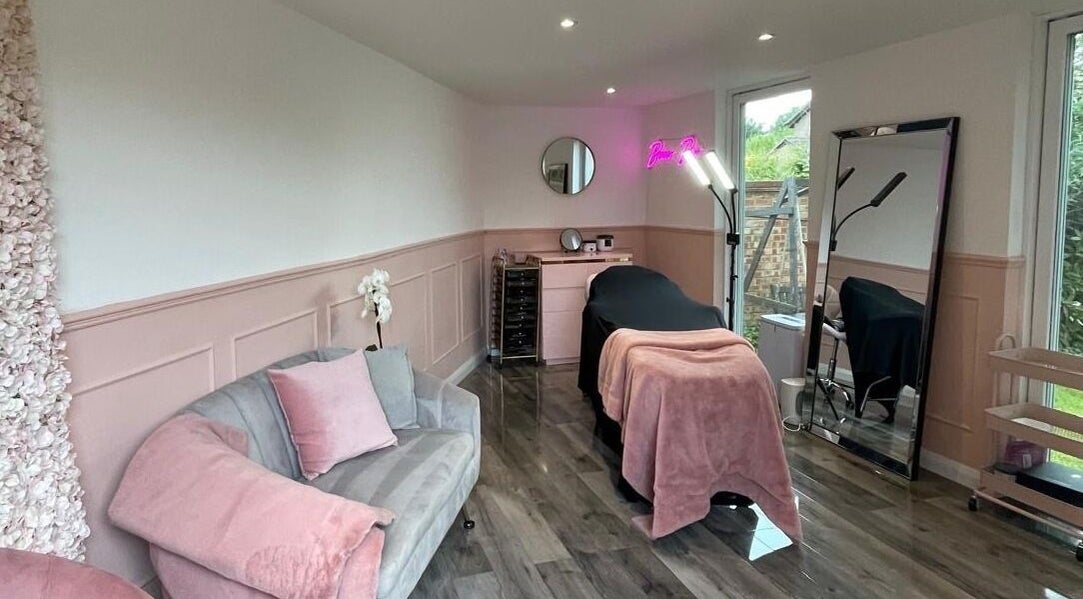 Elegant treatment room at Emma Beauty Mk in Newport Pagnell, England, GB with cozy pink and gray decor.