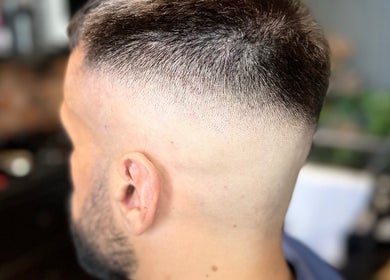 Close-up of a precise fade haircut at Scissorhandssignature, Dubai, Dubai, AE.