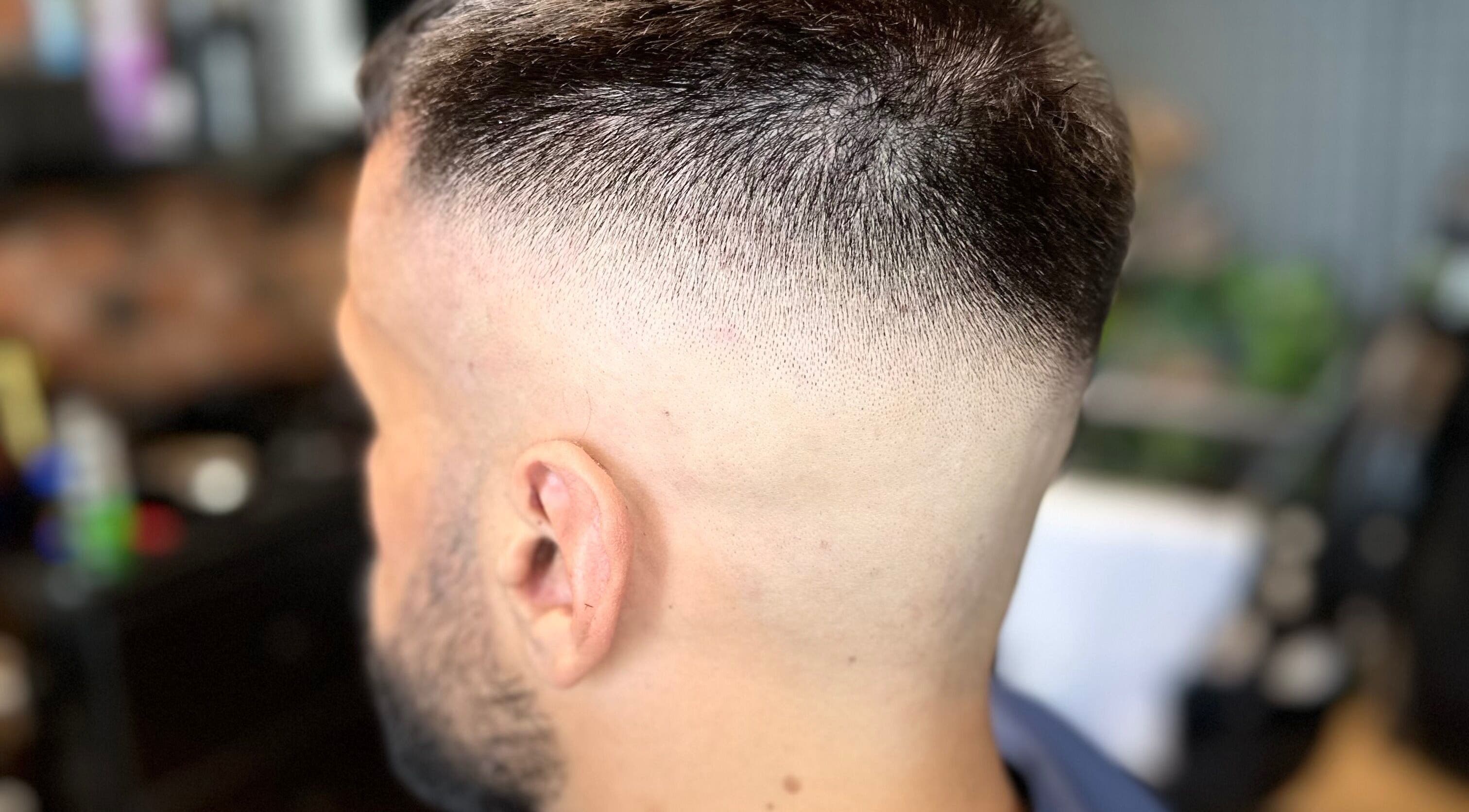 Close-up of a precise fade haircut at Scissorhandssignature, Dubai, Dubai, AE.