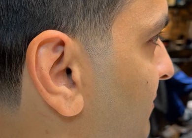 Close-up of a fresh fade haircut at Scissorhandssignature, Dubai, Dubai, AE, showcasing men's grooming excellence.