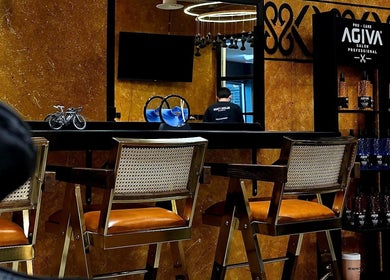 Elegant barber station at Blade and Fade, Riyadh, Riyadh Province, SA featuring stylish chairs and decor.