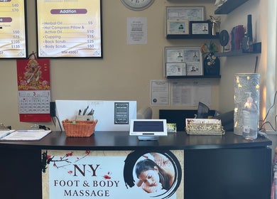 Front desk at NY Massage at Riverview in Gibsonton, Florida, US with decor and service menu.