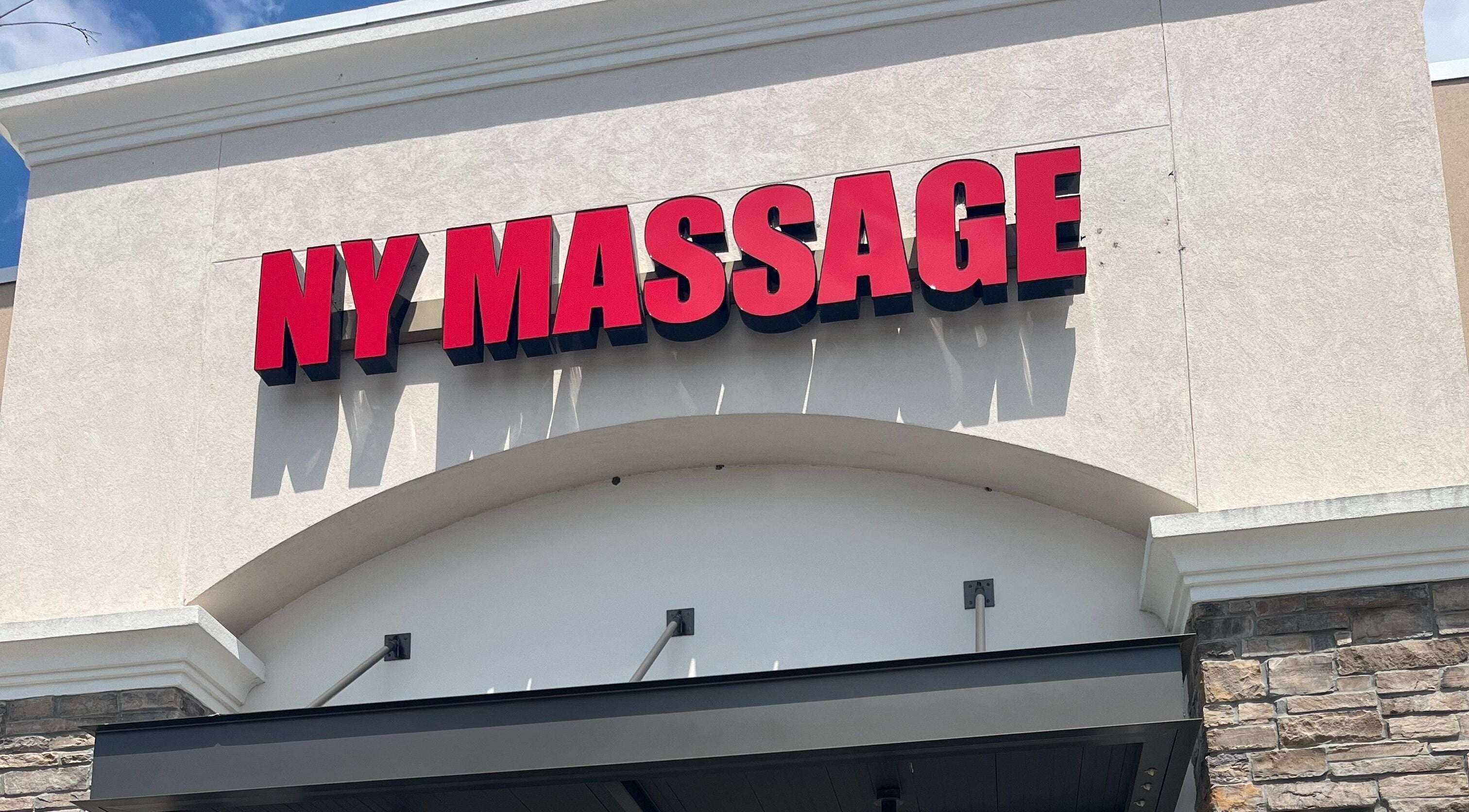 NY Massage at Riverview's entrance in Gibsonton, Florida, US, displaying bold red signage.