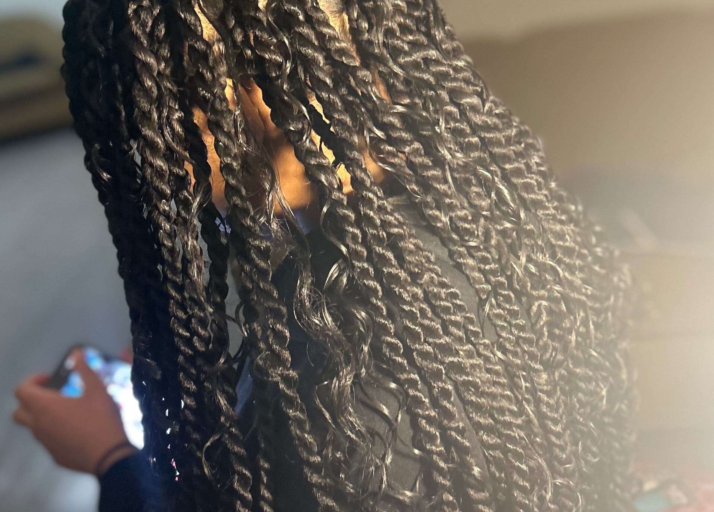 Intricate braided hairstyle at KountryStyles in Marietta, Georgia, US, showcasing professional hairstyling.