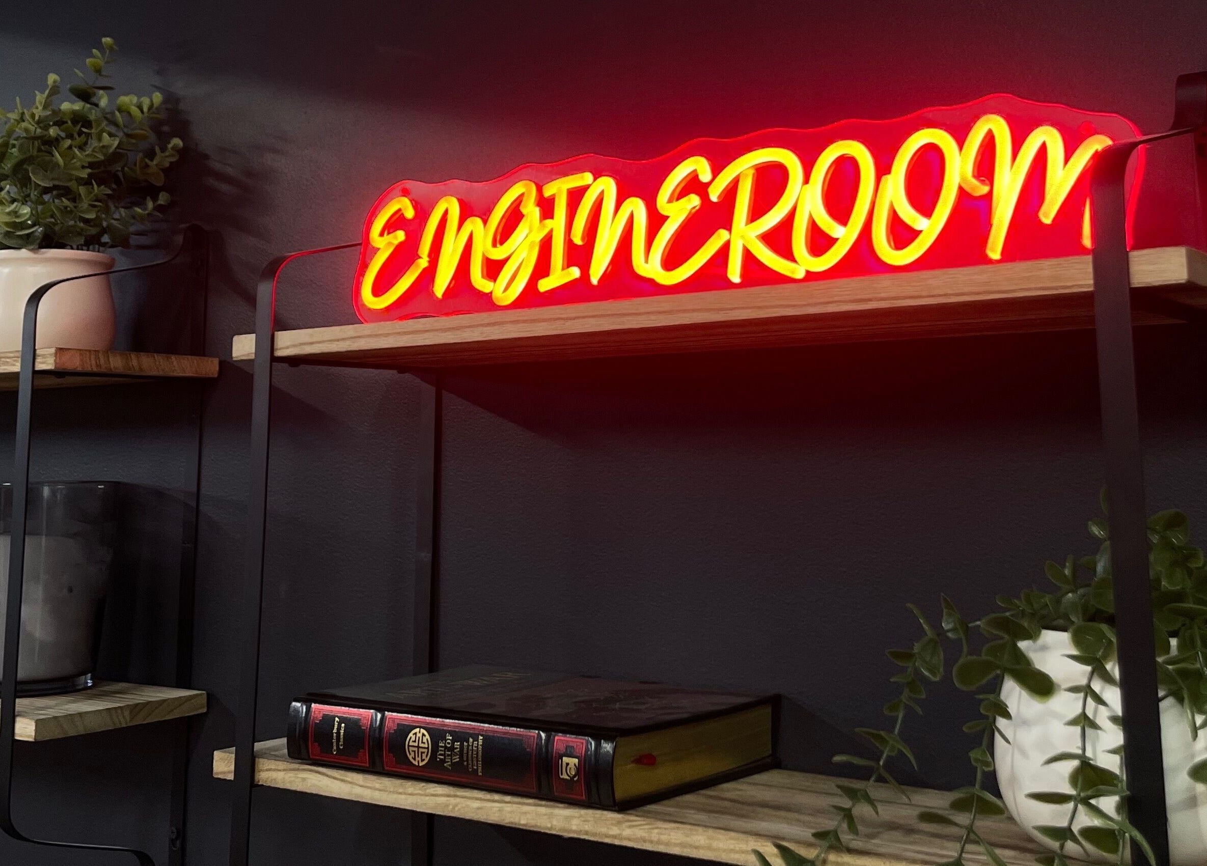 Engineroom Barbers neon sign on stylish shelves in Fountaindale, New South Wales, AU.