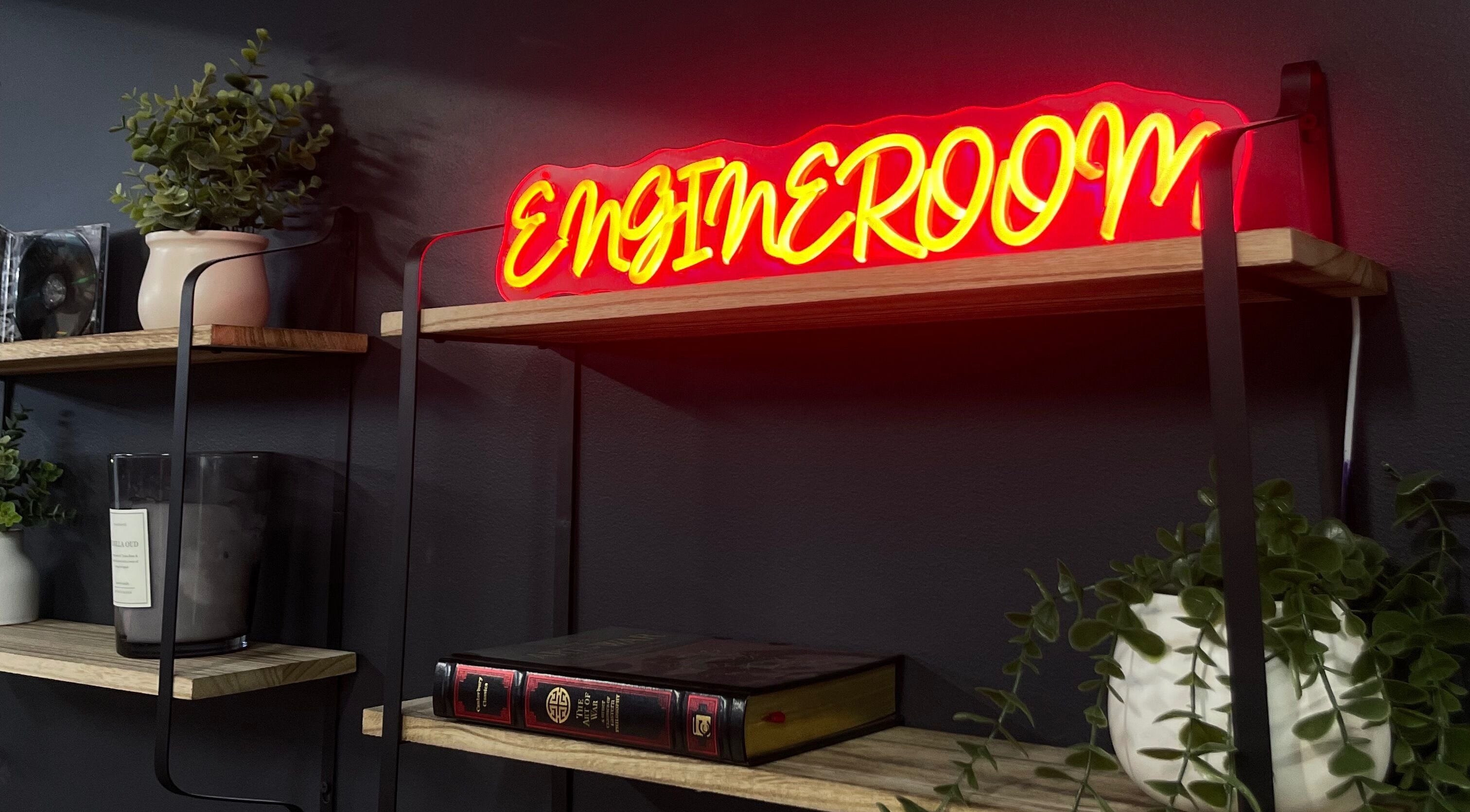Engineroom Barbers neon sign on stylish shelves in Fountaindale, New South Wales, AU.