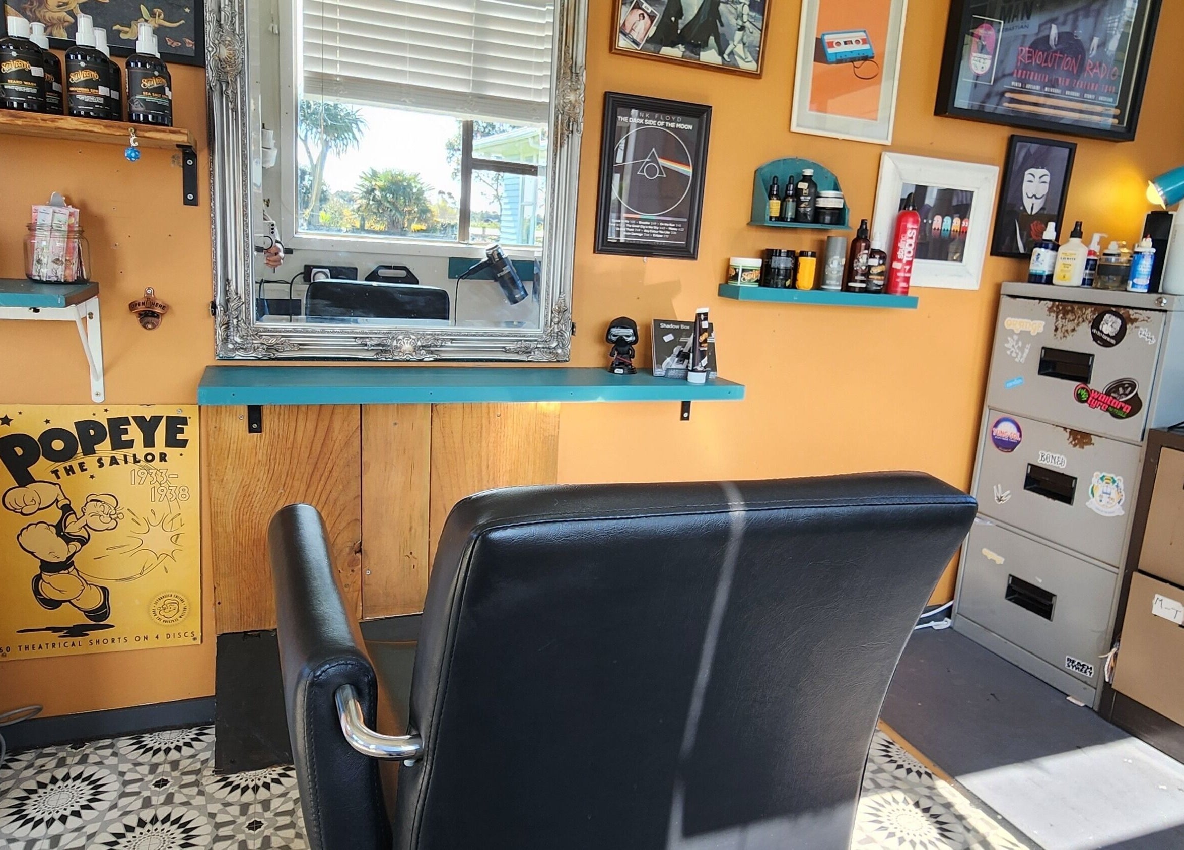 Interior of The Salty Barber, Manawatū-whanganui, showcasing retro decor and barber chair.