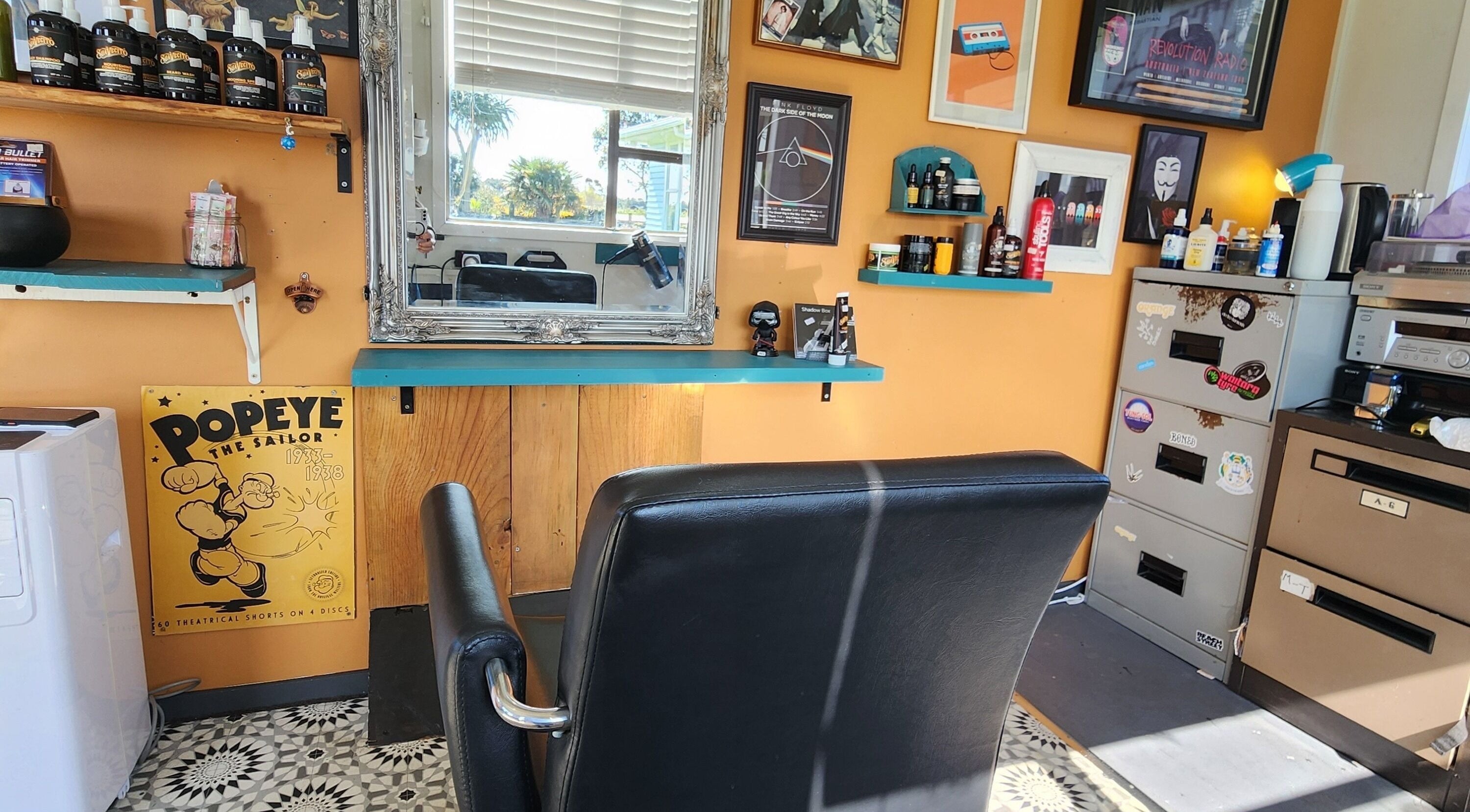 Interior of The Salty Barber, Manawatū-whanganui, showcasing retro decor and barber chair.