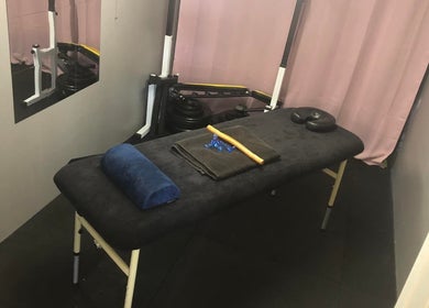 Therapy room at A.S. Sports Therapist, Cramlington, England, GB with massage table and soothing decor.