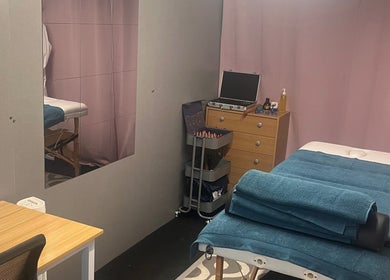 Therapy room at A.S.Sports Therapist, Cramlington, England, GB with massage table and relaxation setup.