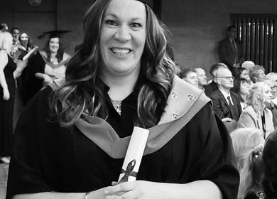 A graduate smiling at A.S.Sports Therapist event in Cramlington, England, GB.