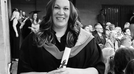 A graduate smiling at A.S.Sports Therapist event in Cramlington, England, GB.