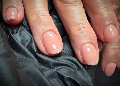 Elegant glossy nails at Nail Envy, Weymouth, England, GB enhance style and sophistication.