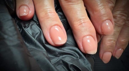 Elegant glossy nails at Nail Envy, Weymouth, England, GB enhance style and sophistication.