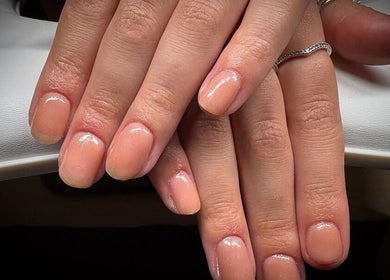 Polished nails showcasing a nude manicure at Nail Envy, Weymouth, England, GB.