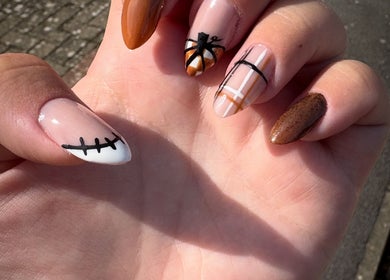 Diverse nail art showcasing autumn tones at Nail Envy, Weymouth, England, GB.