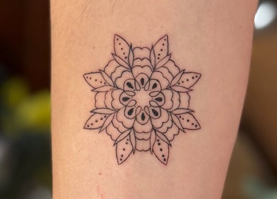 Intricate mandala tattoo design at Divine Line Tattoo, Newquay, England, GB.