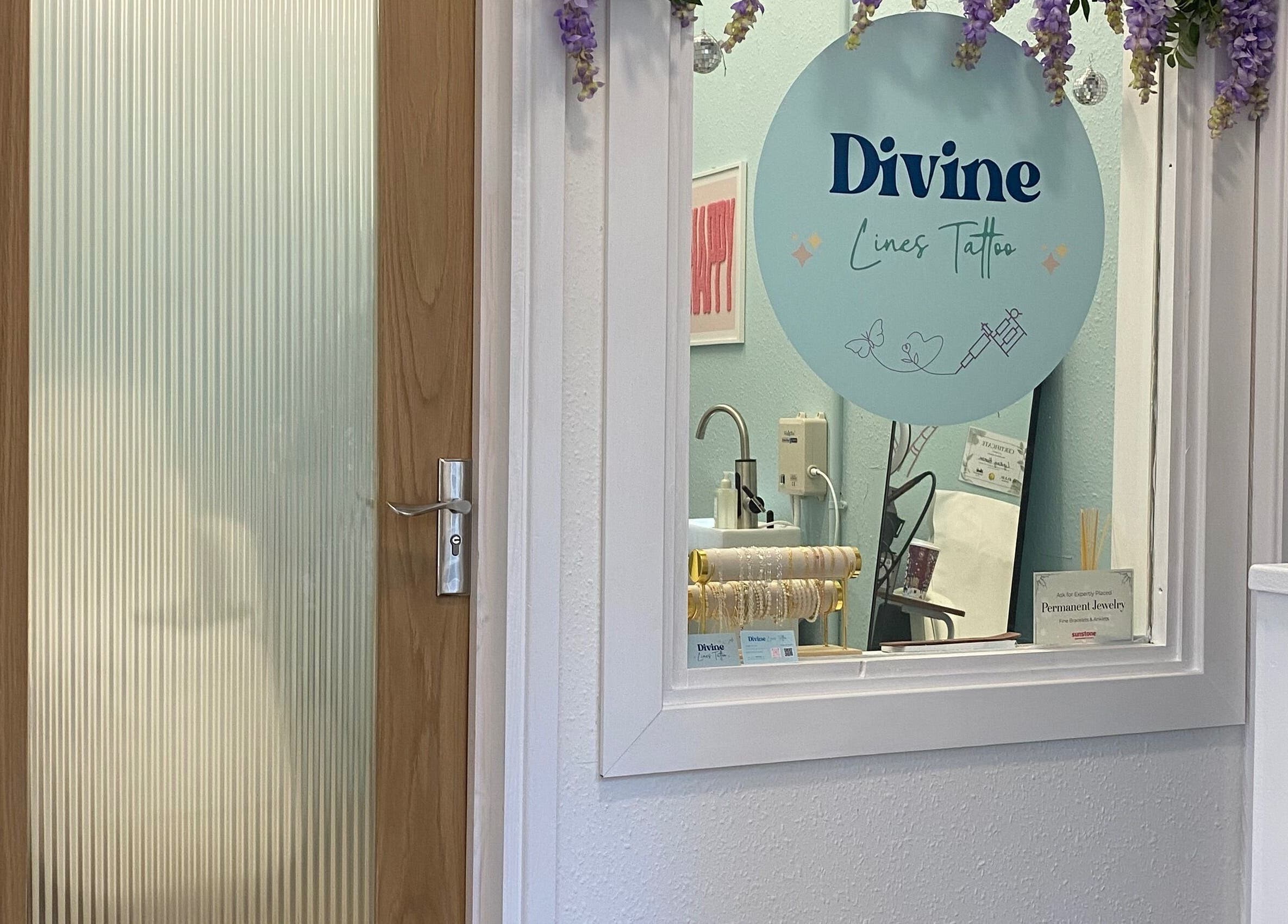 Entrance to Divine Line Tattoo in Newquay, England, GB with a welcoming interior view.