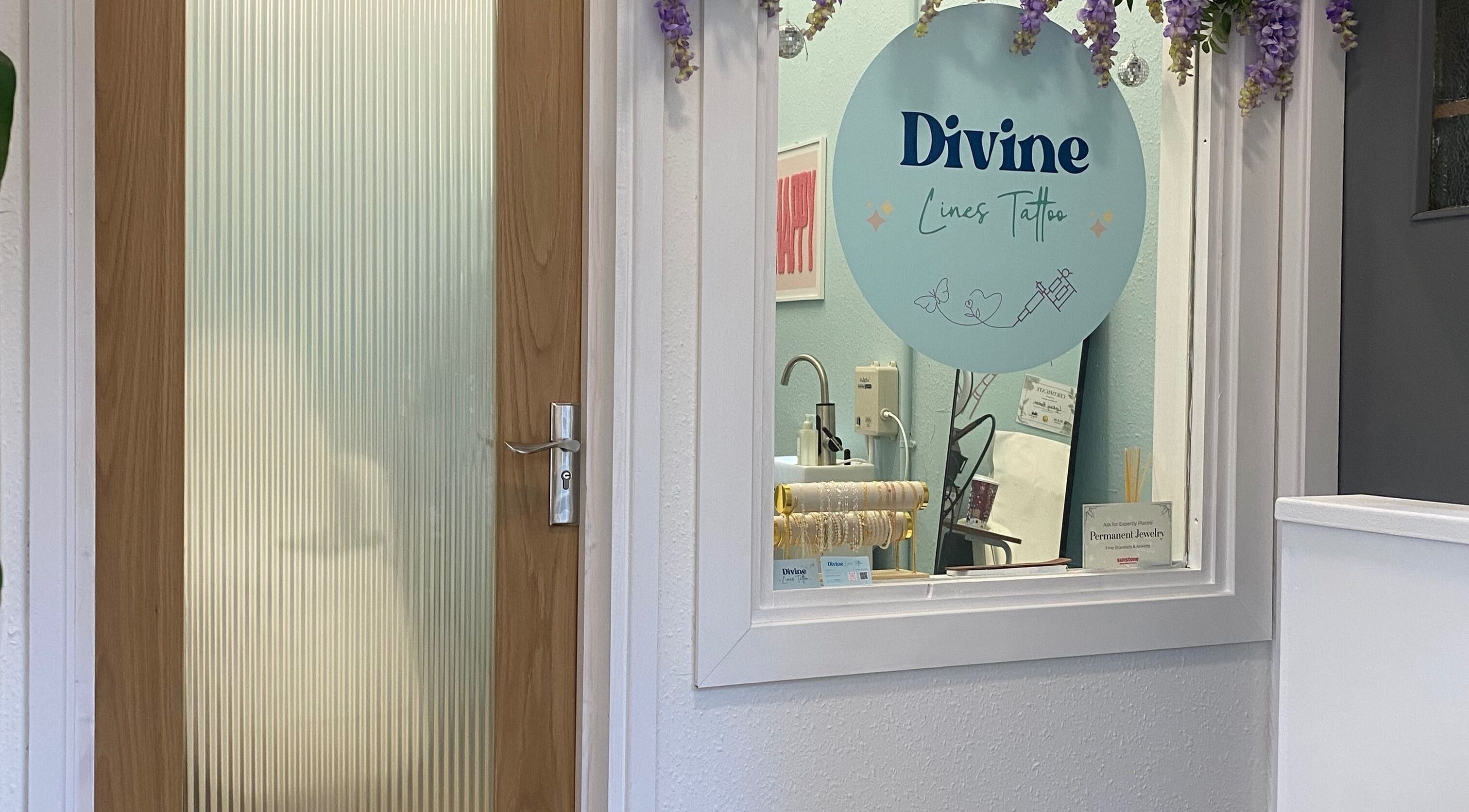 Entrance to Divine Line Tattoo in Newquay, England, GB with a welcoming interior view.
