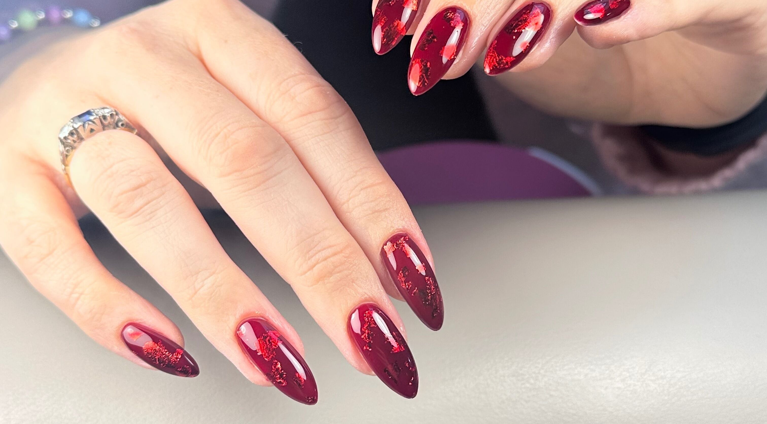 Gorgeous crimson nails with intricate design at Nails by Azi, Royal Leamington Spa, England, GB.