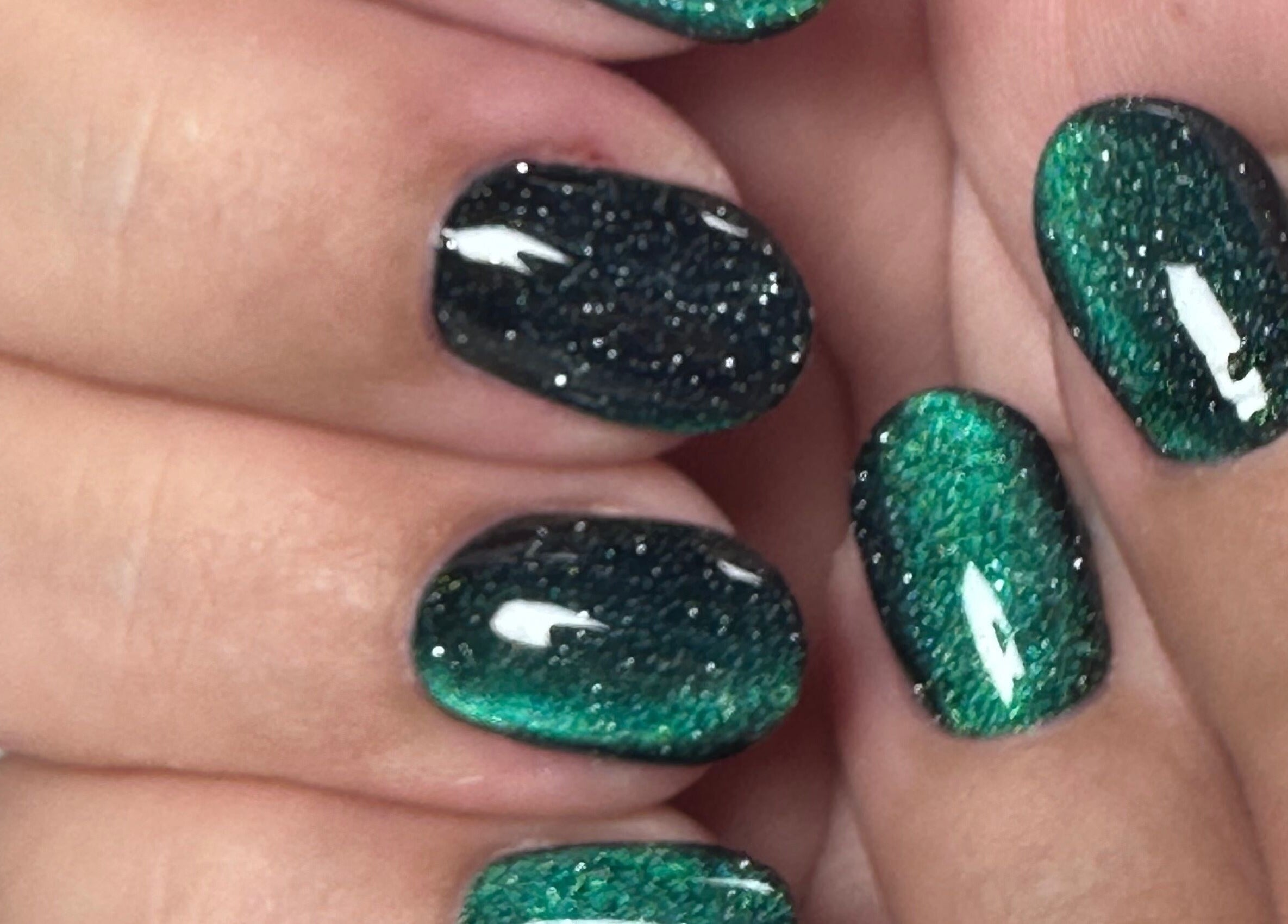 Shimmering green and black nail art by Nails by Azi in Royal Leamington Spa, England, GB.
