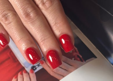 Stunning red nails at Nails by Azi, Royal Leamington Spa, England, GB, showcasing expert manicure.