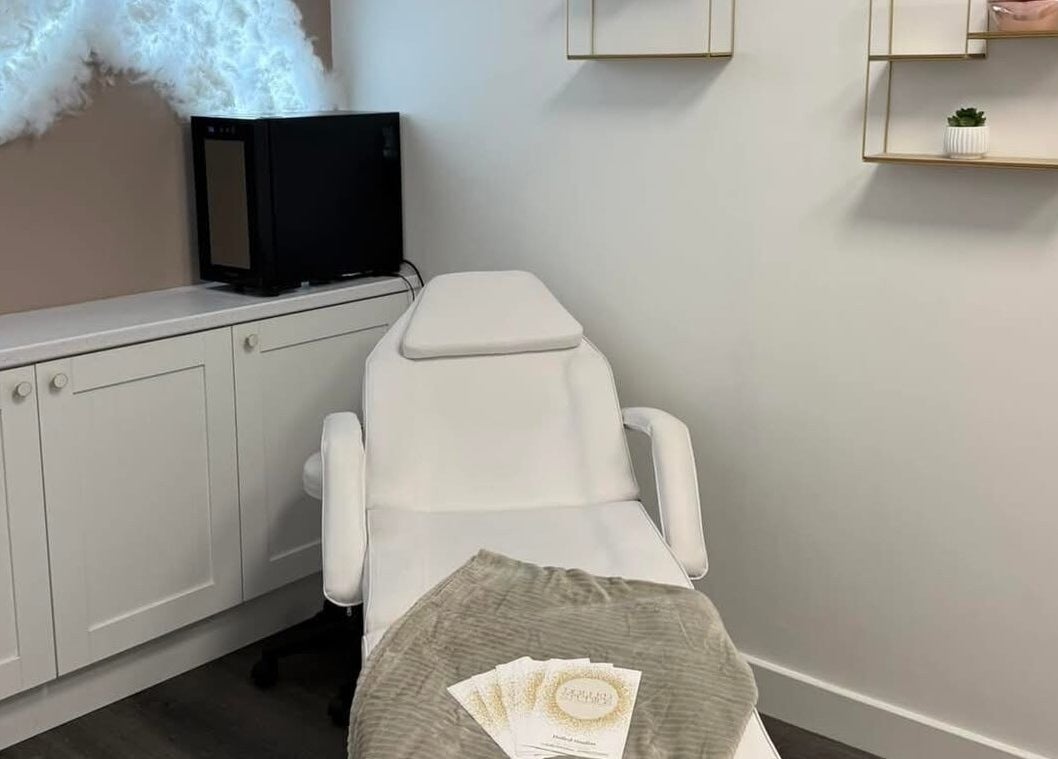 Modern beauty treatment room at Dolled Studios, Clipstone, England, GB with a comfortable spa chair.