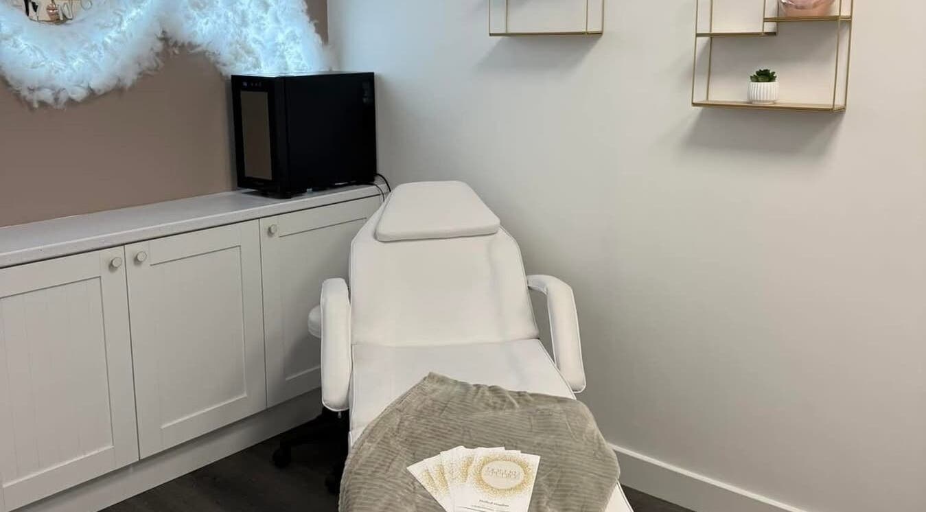 Modern beauty treatment room at Dolled Studios, Clipstone, England, GB with a comfortable spa chair.