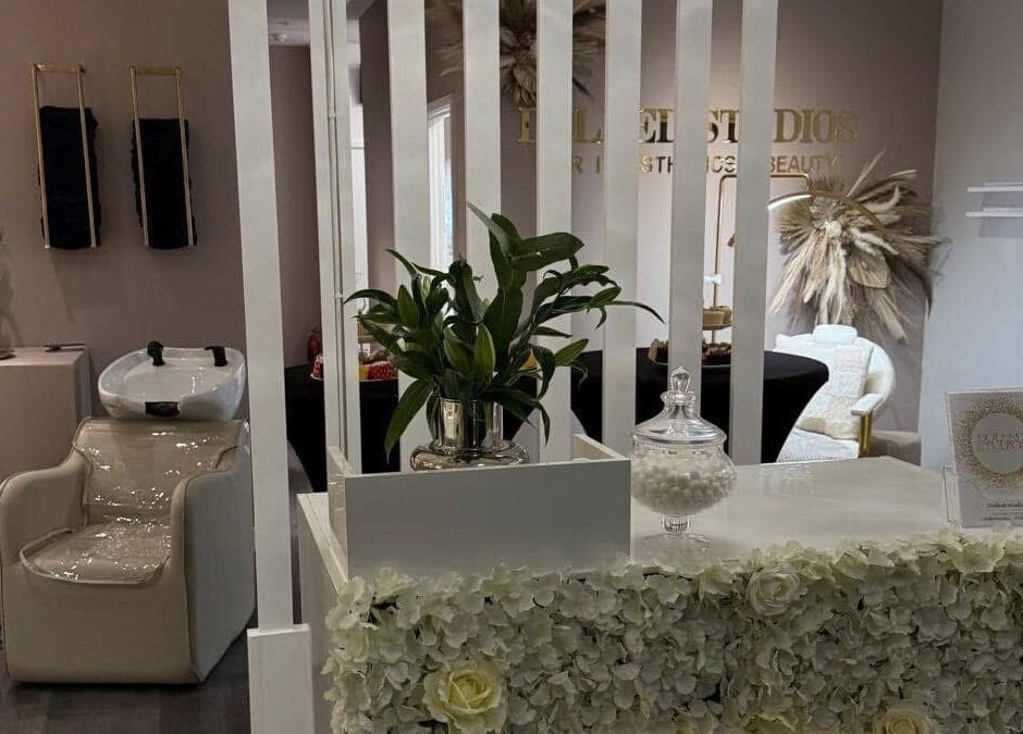 Elegant reception area at Dolled Studios, Clipstone, England, GB with chic decor and plush seating.