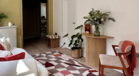 Elegant waiting area at DermaBalance, Royal Tunbridge Wells, England, GB with modern decor and floral accents.