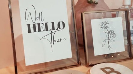 Stylish frames with quotes and flowers at Jenny's Hair Design in Warfield, England, GB.