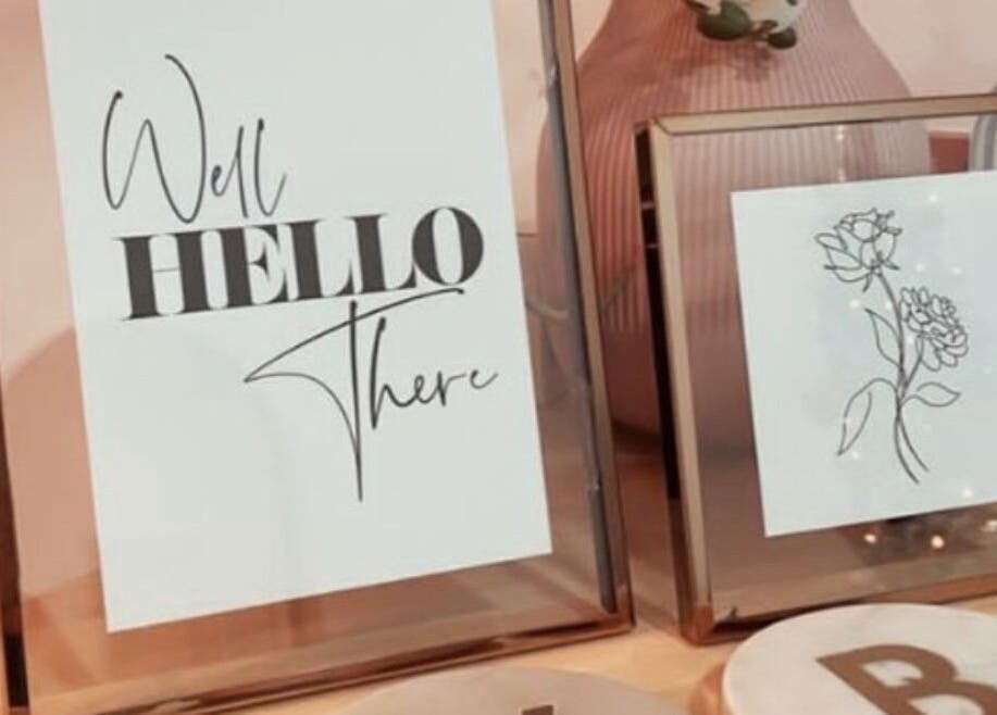 Stylish framed art and decor at Jenny's Hair Design, Warfield, England, GB. Elegant touch to salon ambiance.