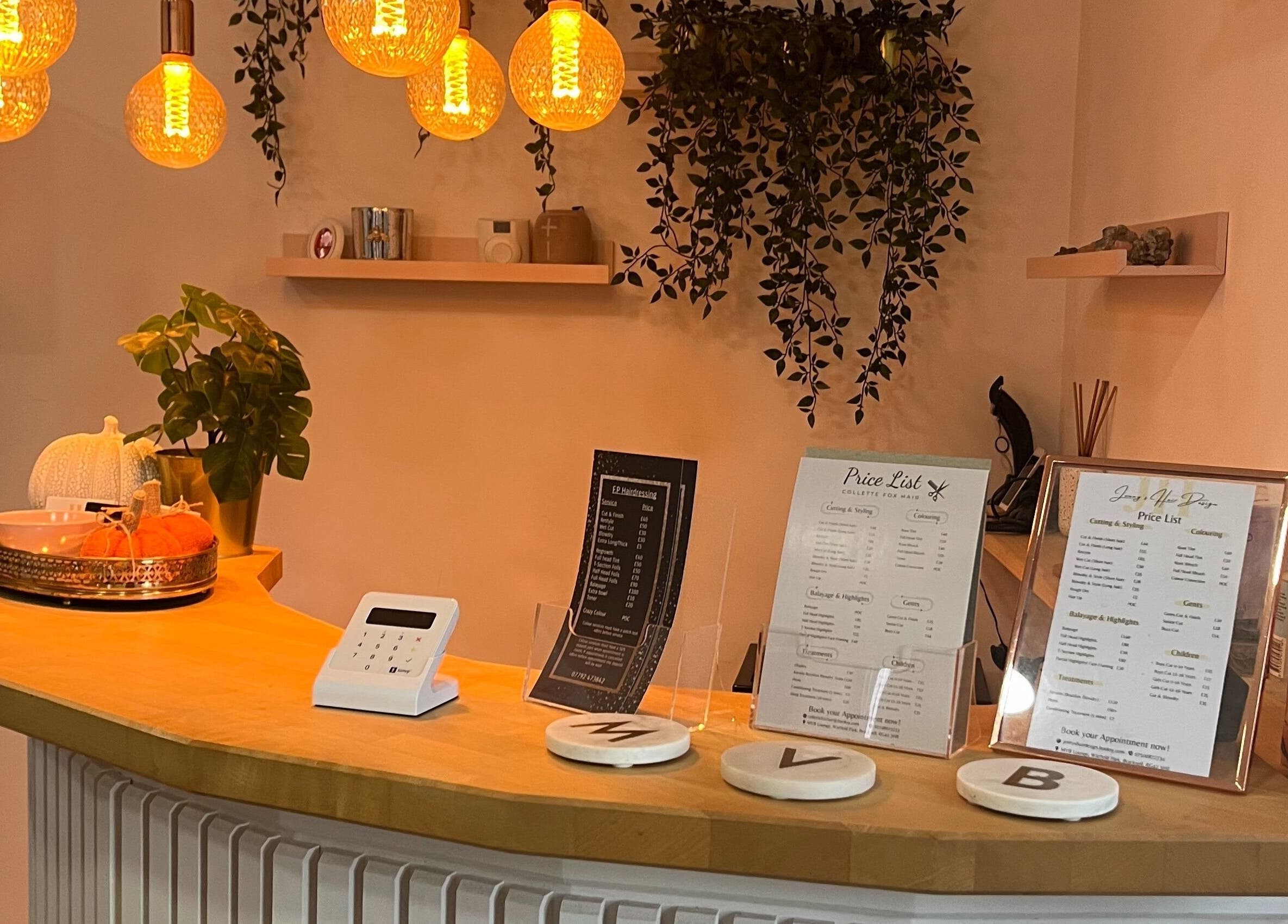 Inviting reception at Jenny's Hair Design, Warfield, England, GB with warm lighting and decor.