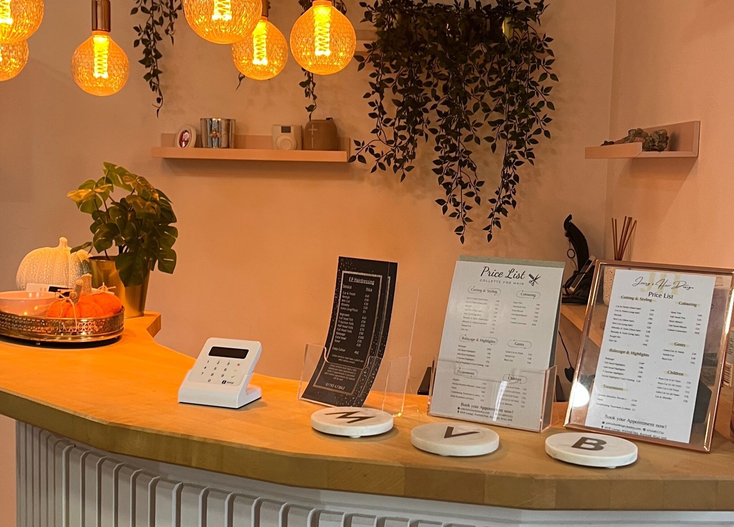 Inviting reception at Jenny's Hair Design, Warfield, England, GB with warm lighting and decor.