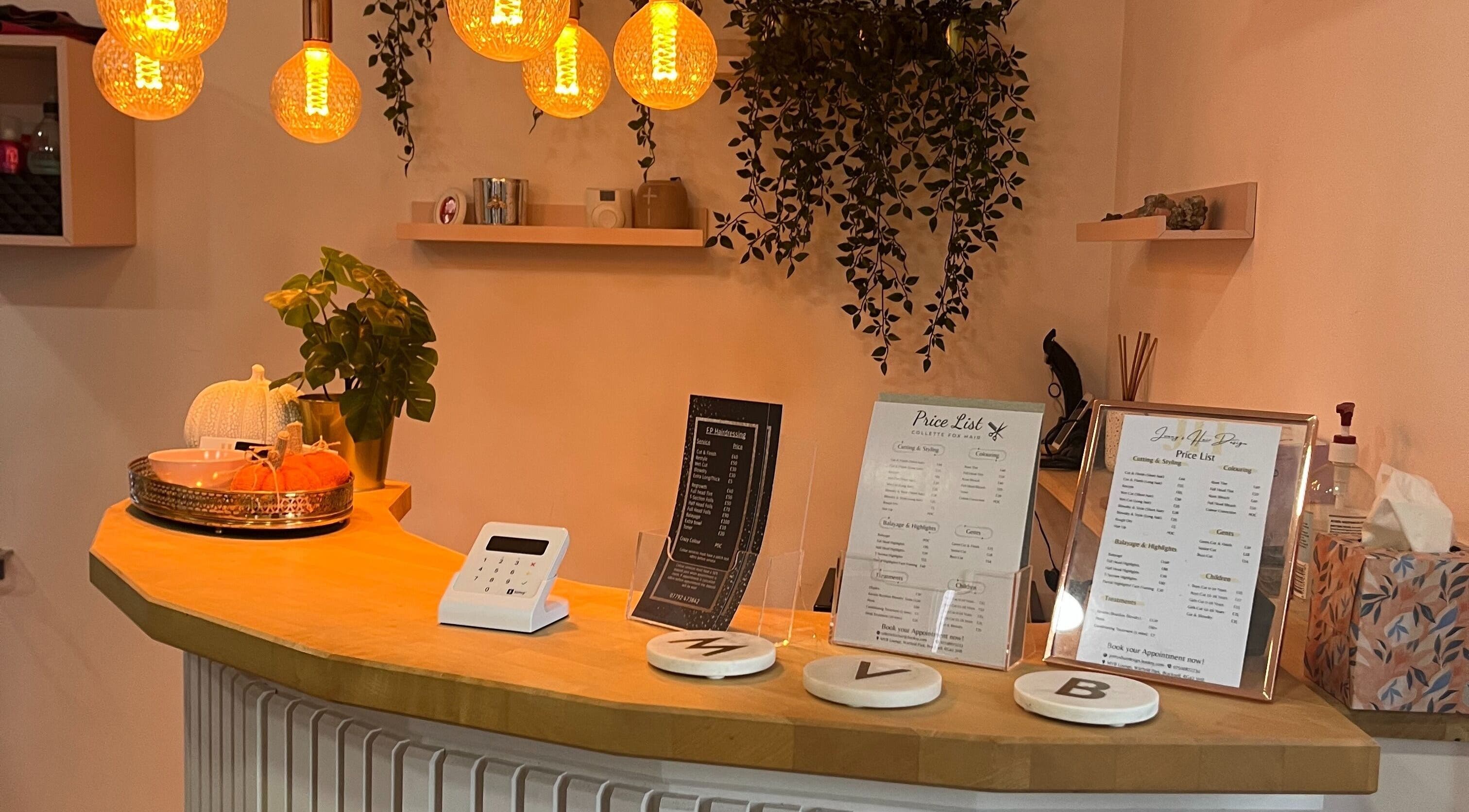 Inviting reception at Jenny's Hair Design, Warfield, England, GB with warm lighting and decor.