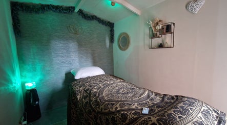 Calming massage room at Urban Oasis Massage Therapy in Swinton, England, GB with cozy decor and ambient lighting.