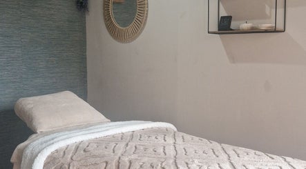 Serene massage room at Urban Oasis Massage Therapy, Swinton, England, GB with cozy decor and soothing ambiance.