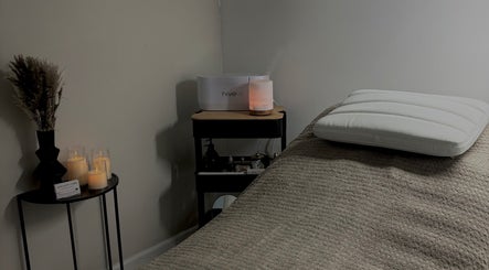 Relaxing spa room at Beauty by Imogen in Portsmouth, England GB, featuring candles and elegant decor.